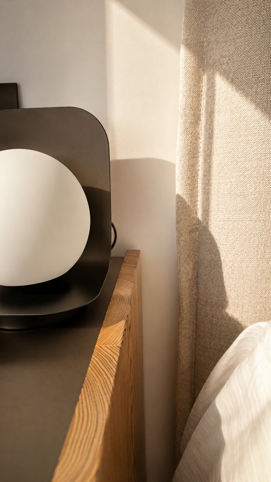 Warm lamp light against stone in the Nyx residence