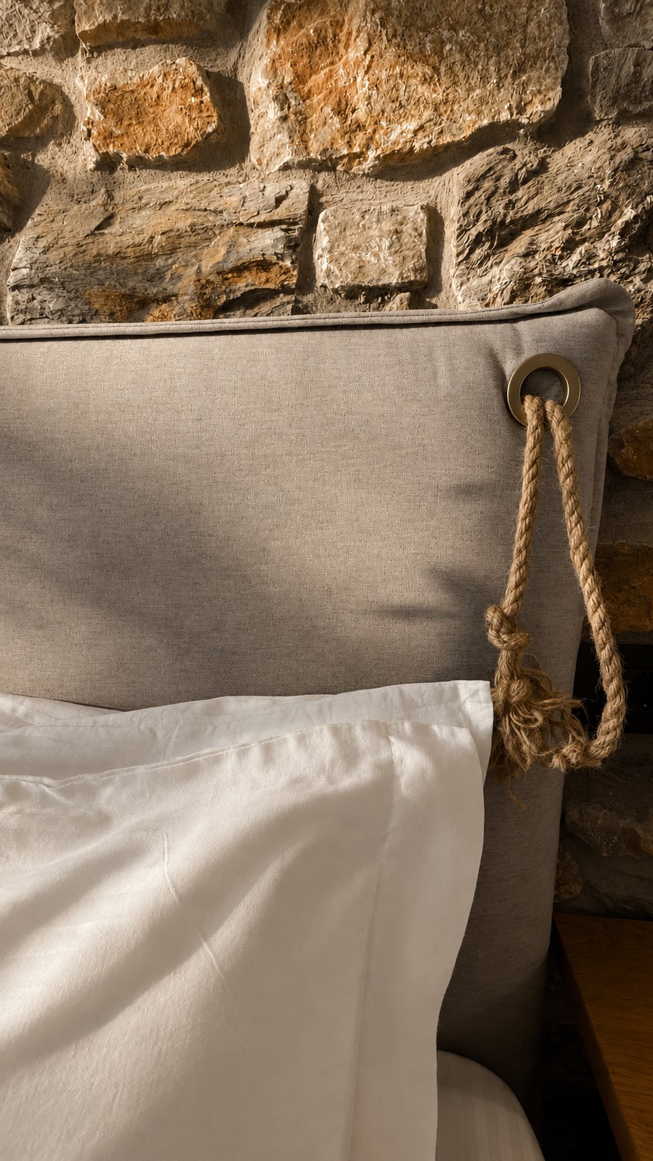 Rope and stone detail by the bed
