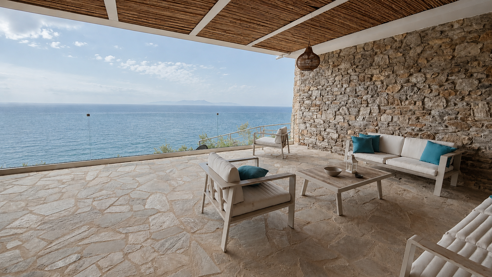 Expansive Nyx terrace with panoramic sea view and outdoor seating