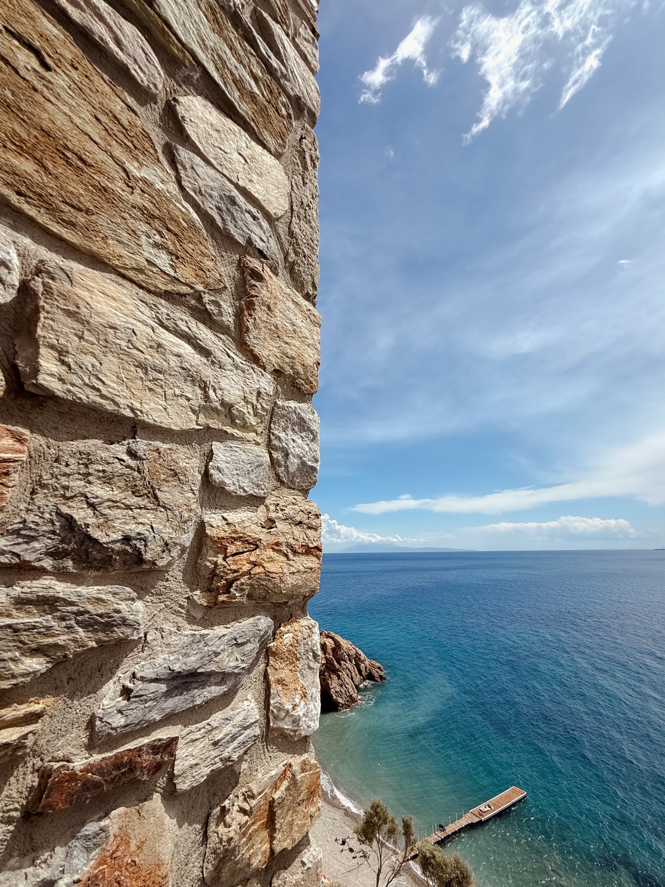 Stone wall opening to the sea