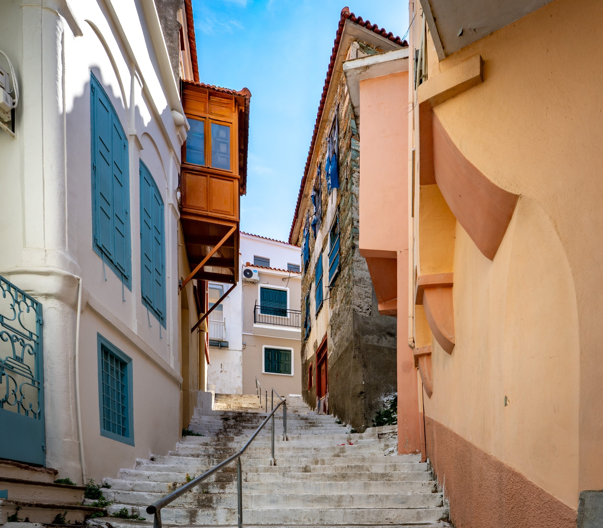 Stairs between painted houses