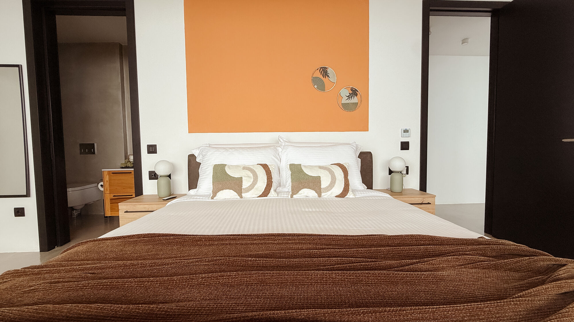 Bedroom two with warm accent wall